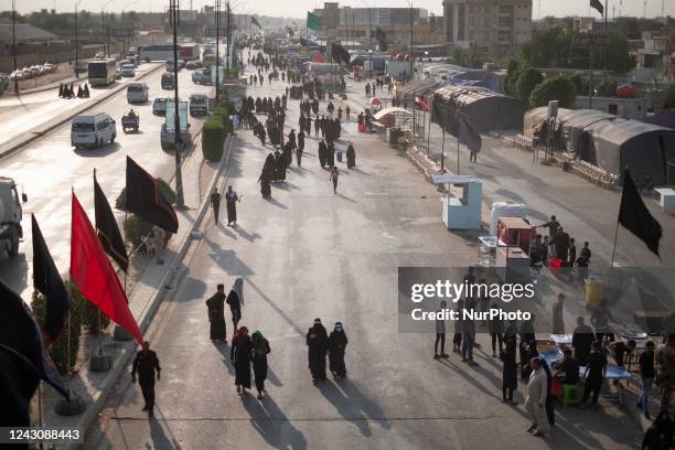Shi'ite pilgrims walk along a road in Hillah in Babel province in Iraq during the commemoration of Arbain, September 9, 2022. Arbain walking is a...