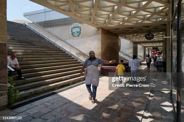 Foreign man working in an Islamic butcher shop gestures in the old bazaar on September 6, 2022 in Skopje, North Macedonia. The nationalist opposition...