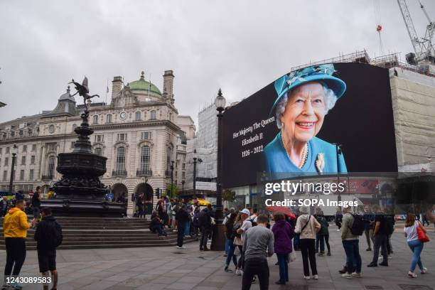 Piccadilly Lights in Piccadilly Circus displays a tribute as Queen Elizabeth II dies, aged 96.