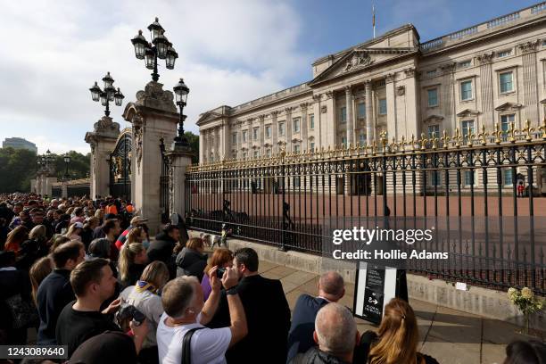 People gather outside Buckingham Palace following the death of Queen Elizabeth II, on September 10, 2022 in London, United Kingdom. Elizabeth...