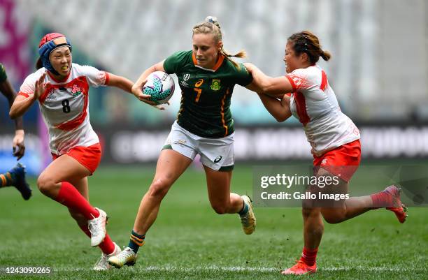 Eloise Webb of South Africa and Yume Okuroda and Mei Ohtani of Japan during day 2 of the Rugby World Cup Sevens 2022 Challenge Quarter Finals match...