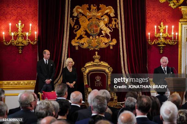 Britain's Prince William, Prince of Wales and Britain's Camilla, Queen Consort listen as Britain's King Charles III speaks during a meeting of the...