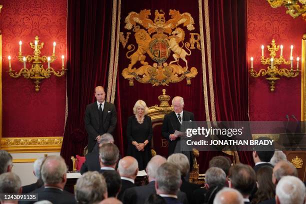 Britain's Prince William, Prince of Wales and Britain's Camilla, Queen Consort listen as Britain's King Charles III speaks during a meeting of the...