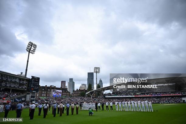 England and South African cricketers wear black armbands as they observe a minute's silence with an honour guard of British Armed Forces personnel...