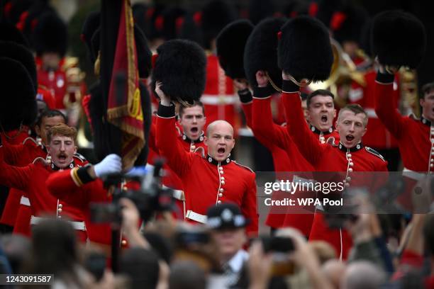Members of the Coldstream Guards raise their Bearskin hats as they salute the new King, following the proclamation of Britain's King Charles III, in...