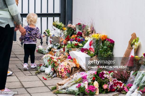 Wellwishers place flowers in front of the British Embassy in Copenhagen, Denmark, on September 10 to pay tribute two days after Queen Elizabeth II...