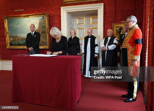 The Queen signs the Proclamation of Accession of King Charles III, watched by the Prince of Wales, Prime Minister Liz Truss , Archbishop of...