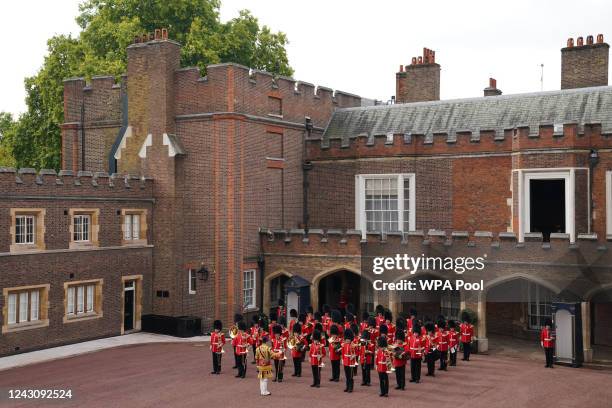 Members of the Coldstream guards cheer as the Principal Proclamation is read from the balcony overlooking Friary Court at St James's Palace as King...