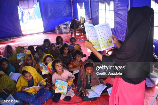 Displaced Pakistani flood victims children attend their class as they study at a Temporary Learning Centre for flood affected area of children...