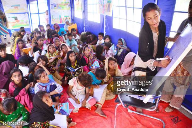 Displaced Pakistani flood victims children attend their class as they study at a Temporary Learning Centre for flood affected area of children...