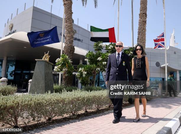 The British and UAE flag fly at half-mast during a memorial for the Queen by the British Embassy in Dubai on September 10 outside the Queen Elizabeth...