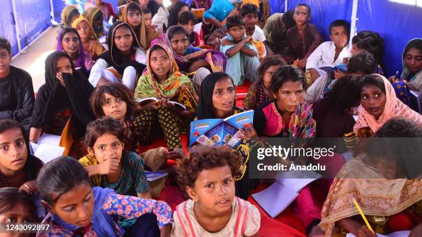 Displaced Pakistani flood victims children attend their class as they study at a Temporary Learning Centre for flood affected area of children...