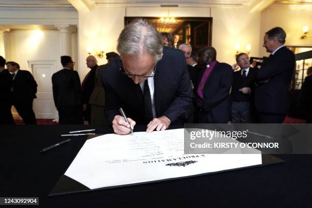 Britain's Former Prime Minister Tony Blair signs the Proclamation of Accession of King Charles III following the Accession Council ceremony at St...