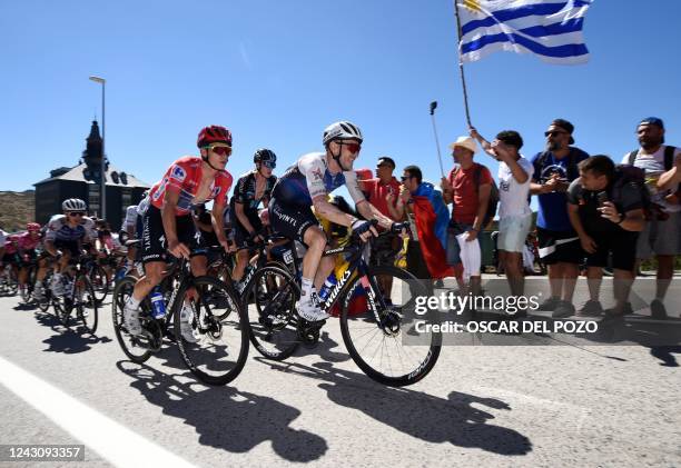 Team Quick Step's Belgian cycler Remco Evenepoel and Team Quick Step's Belgian cycler Dries Devenyns cycle during the 20th stage of the 2022 La...