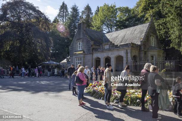 People lay flowers at the gate of Balmoral Castle in Aberdeenshire, Scotland on September 10, 2022.