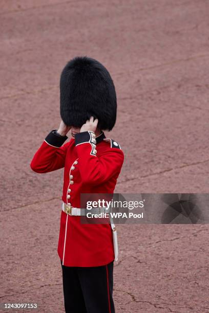 Members of the Coldstream Guards raise their Bearskin hats as they salute the new King, following the proclamation of King Charles III at St James's...