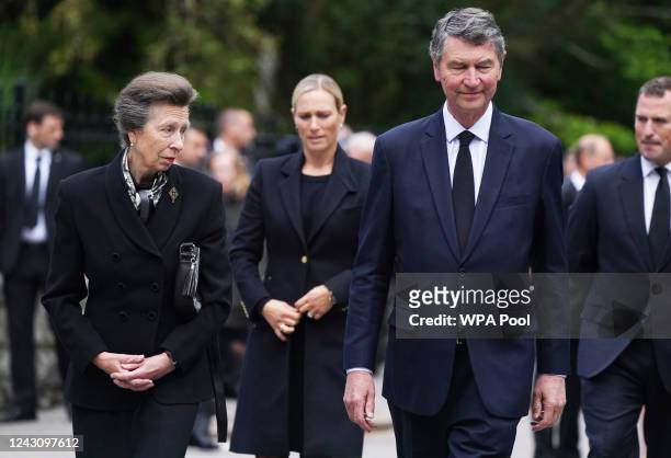 Peter Phillips, Zara Tindall, Princess Anne, Princess Royal and Vice Admiral Timothy Laurence look arrive to look messages and floral tributes left...