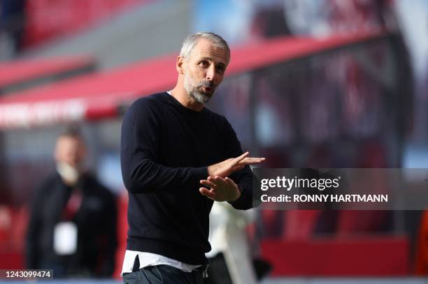 Leipzig's German head coach Marco Rose applauds the fans after the end of the German first division Bundesliga football match between RB Leipzig and...