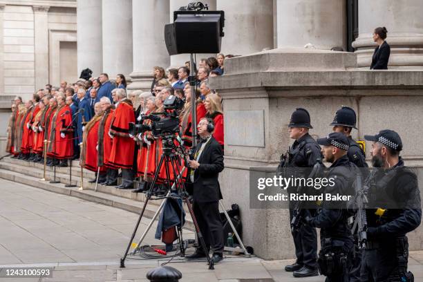 Armed City Police officers watch over City officials during the second formal Proclamation ceremony for King Charles III at Royal Exchange in the...