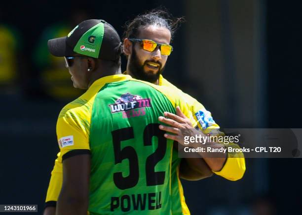 Imad Wasim and Rovman Powell of Jamaica Tallawahs celebrate the dismissal of Andre Russell of Trinbago Knight Riders during the Men's 2022 Hero...