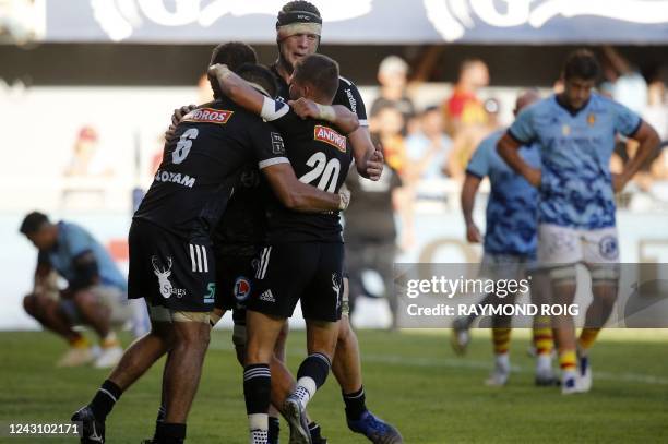 Brive's players celebrate their victory over Brive during the French Top14 rugby union match between USA Perpignan and Brive at the Aime-Giral...