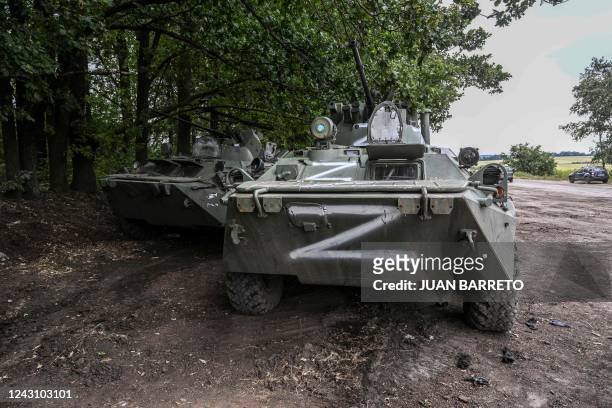 This photograph taken on September 10, 2022 shows Russian military vehicles in Balakliya, Kharkiv region, amid the Russian invasion of Ukraine. -...