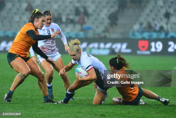 Grace Crompton of England tackled by Faith Nathan of Australia during Women's Championship Quarter Finals match between Australia and England on day...