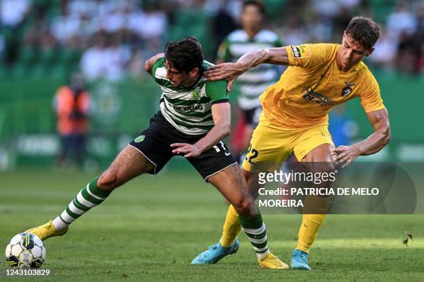 Sporting's Portuguese forward Francisco Trincao vies with Portimonense's Portuguese defender Filipe Relvas during the Portuguese league football...