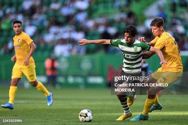 Sporting's Portuguese forward Francisco Trincao vies with Portimonense's Portuguese defender Filipe Relvas during the Portuguese league football...