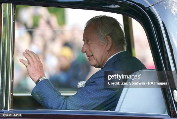 King Charles III waves to members of the public outside Clarence House, London, after he was formally proclaimed monarch by the Privy Council, and...