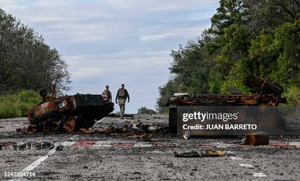 Destroyed armored vehicles litter the road in Balakliya, Kharkiv region, on September 10 amid the Russian invasion of Ukraine. - Ukrainian forces...