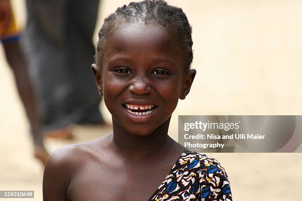 portrait of smiling girl in dakar, senegal. - senegal africa stock pictures, royalty-free photos & images