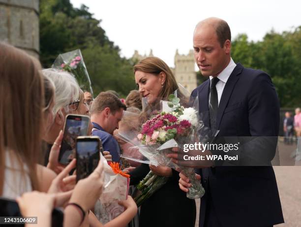 Catherine, Princess of Wales and Prince William, Prince of Wales meet members of the public at Windsor Castle on September 10, 2022 in Windsor,...