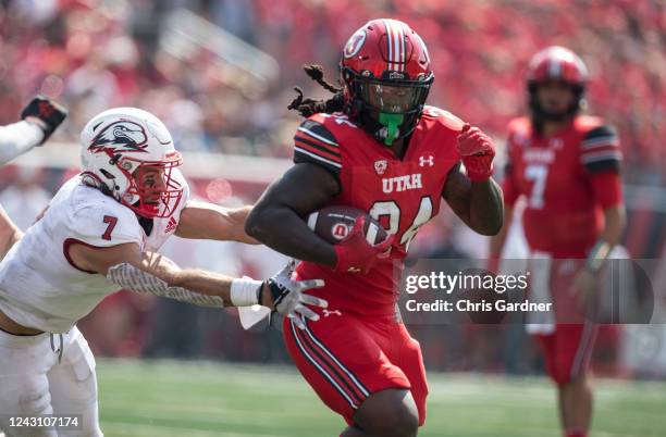 Chris Curry of the Utah Utes rushes past Mitch Price of the Southern Utah Thunderbirds during the first half of their game September 10, 2022 at...