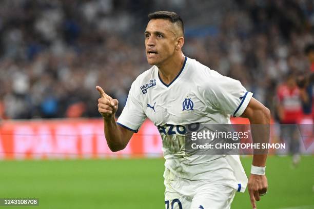 Marseille's Chilean forward Alexis Sanchez celebrates scoring his team's first goal during the French L1 football match between Olympique Marseille...