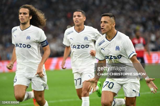 Marseille's Chilean forward Alexis Sanchez celebrates scoring his team's first goal during the French L1 football match between Olympique Marseille...