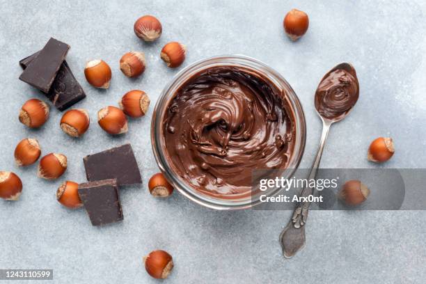 chocolate nut spread in jar - chocolate melting stock pictures, royalty-free photos & images