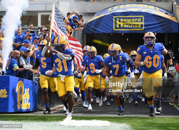 Erick Hallett II of the Pittsburgh Panthers leads his teams out onto the field before the start of the game against the Tennessee Volunteers at...