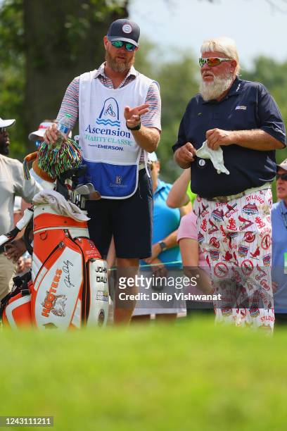 John Daly confers with his caddie, form St. Louis Cardinals pitcher Ryan Franklin on the tee box of the seventh hole during the second round of the...