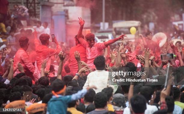 Youngsters react as a dhol tasha pathak of Guruji Talim Ganpati mandal perform as large number of devotees gather to watch Ganpati visarjan...