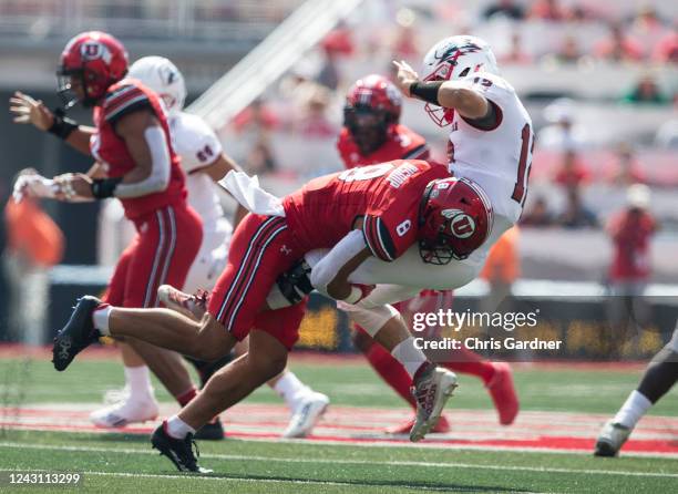 Justin Medlock of the Utah Utes takes down quarterback Justin Miller of the Southern Utah Thunderbirds during the first half of their game September...