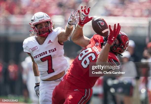 Dalton Kincaid of the Utah Utes pulls in a pass against Mitch Price of the Southern Utah Thunderbirds during the first half of their game September...