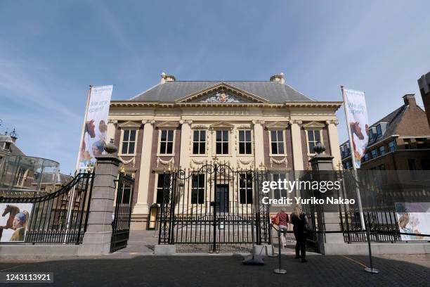 The Mauritshuis"nMuseum stands between flags reading "We are open" on June 2, 2020 in The Hague, Netherlands. Museums reopened on June 1, but tickets...
