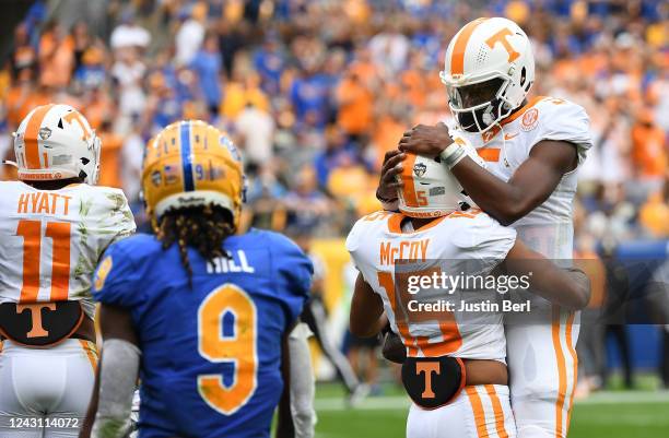 Bru McCoy of the Tennessee Volunteers celebrates with Hendon Hooker of the Tennessee Volunteers after making a catch for a 32-yard touchdown...