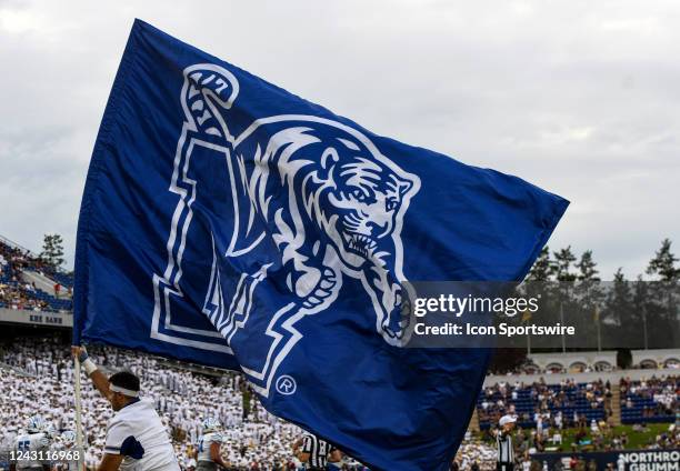 Memphis Tigers cheerleader runs across the field following a touchdown during the Memphis Tigers game versus the Naval Academy Midshipmen on...