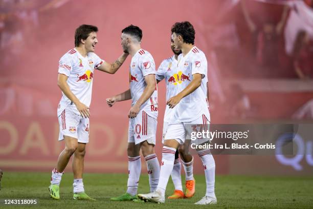 Lewis Morgan of New York Red Bulls celebrates his goal with teammates in the second half of the Major League Soccer match against the New England...