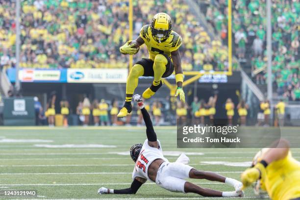 Seven McGee of the Oregon Ducks jumps over Demetrius Crosby Jr. #31 of the Eastern Washington Eagles during the first half of the game at Autzen...