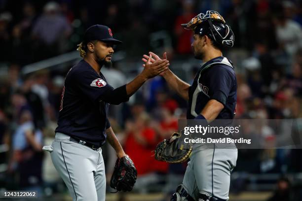 Emmanuel Clase and Luke Maile of the Cleveland Guardians celebrate a 6-4 victory against the Minnesota Twins at Target Field on September 10, 2022 in...