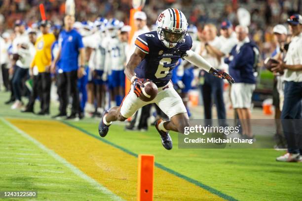 Wide receiver Ja'Varrius Johnson of the Auburn Tigers dives into the end zone for a touchdown that was later called back during the second half of...