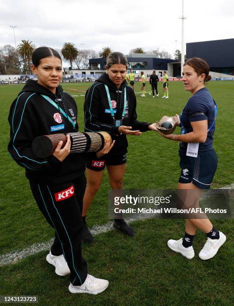 Gifts are exchanged during the 2022 S7 AFLW Round 03 match between the Carlton Blues and the Port Adelaide Power at Ikon Park on September 11, 2022...